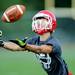 Whitmore Lake football player reaches for a pass during a practice drill at the school on Tuesday, August 13, 2013. Melanie Maxwell | AnnArbor.com